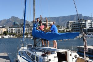 Sailing Cape Town Group of people on a sailing charter boat tour in a marina with mountain view